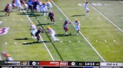 Luther Burden III stiff-arms a UMass defender on a 61-yard TD run for Mizzou.